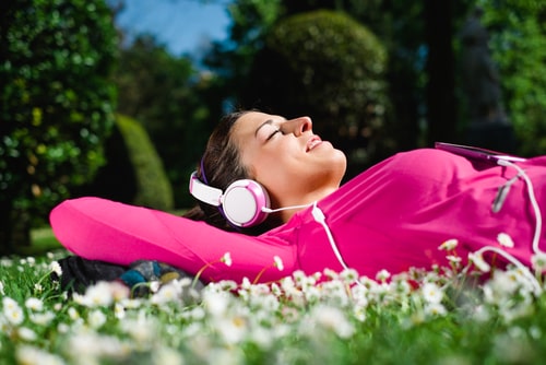 Athlete lying down and resting in the park