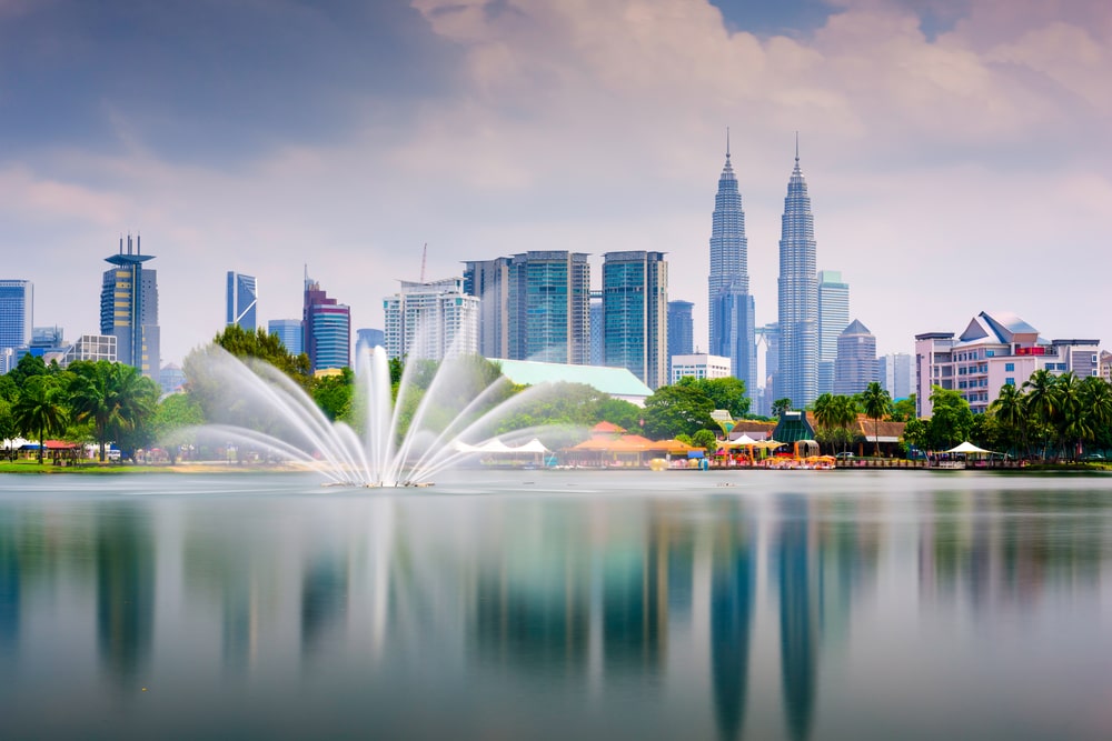 Kuala Lumpur skyline and park with fountain