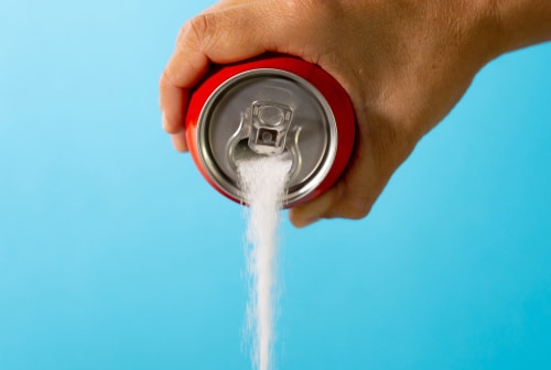 Soda can pouring sugar unhealthy soda concept