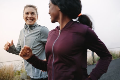 Female friends walking for fitness in the morning